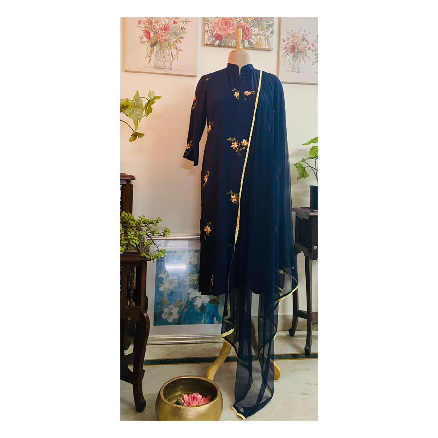 This beautiful suit set from Mulmul And More is done in super soft and flowy modal cotton and comes with a net dupatta edged with light lemon coloured lace.  The kurta has beautiful crewel embrodiery ( a technique 1000 years old) done on both the front and back of the kurta. This set is from Mulmul Sustainables by Mulmul And More by Priyanka Bhambry 