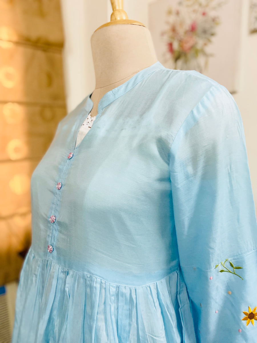 This is a very delicate suit done in pure silk Muslin and embelished with dainty silk thread embroidery, it comes with a vintage design lace slip in Mulmul and modal cotton farshi which is also embelished with embroidery. Both the Kurta and Farshi are embroidered front and back.From Mulmul And More by Priyanka Bhambry